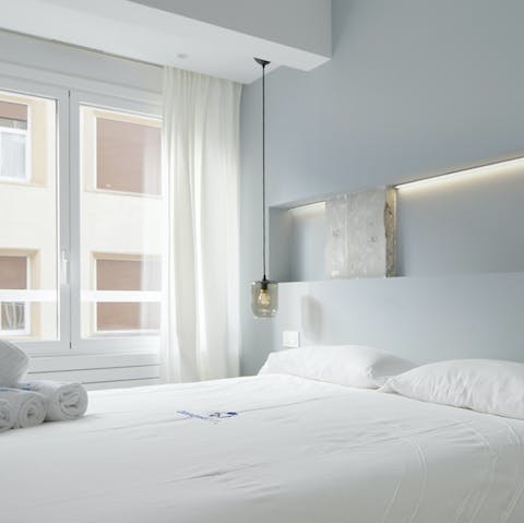 Wake up after a restful sleep and pry open the curtains to let natural light sweep through the room