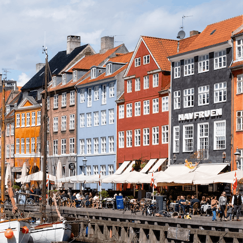Marvel at the coloured buildings in Nyhavn,  just around the corner