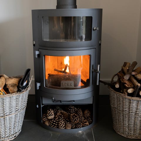 Get a fire crackling in the wood-burning stove to keep warm