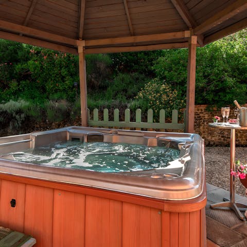 Enjoy a relaxing soak in the private hot tub