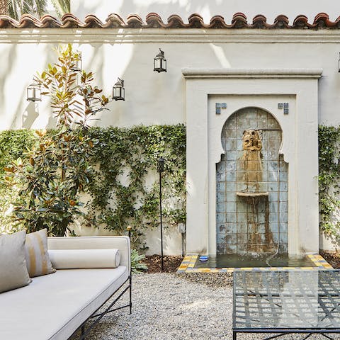 Sit outside in the building's renaissance-inspired garden