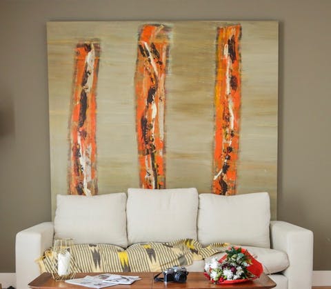 Stretch out on the sofa and admire the works of abstract art all around you