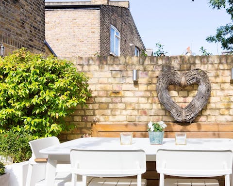 Soak up the sun during summer days in the home's beautiful garden