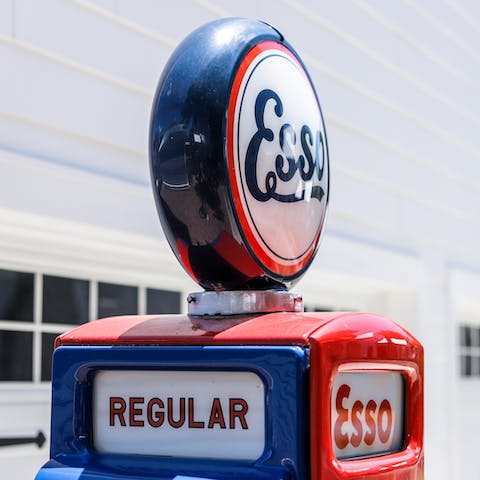 Admire the vintage red and blue petrol pump