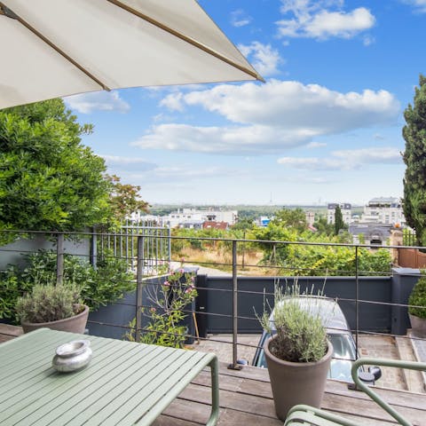 Admire sweeping views from the terrace while the kids play in the garden
