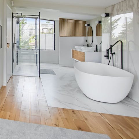 Take your vacation relaxation to the next level in the main bedroom's in-room tub