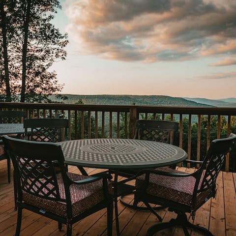 Sip whisky on the deck and admire the view of the mountains and valley below