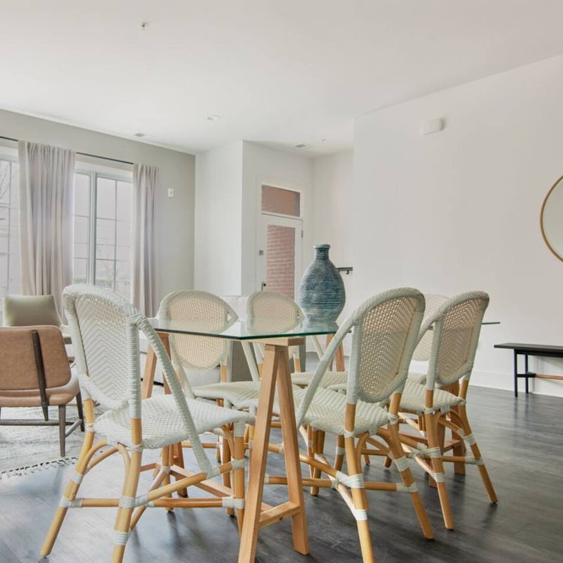 Gather the group around the glass-topped dining table