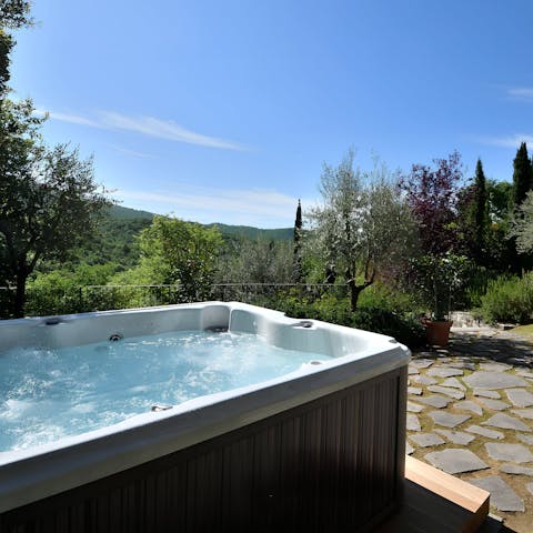 Savour the views while soaking in the hot tub 