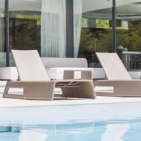 Lounge on the space-age style pool furniture