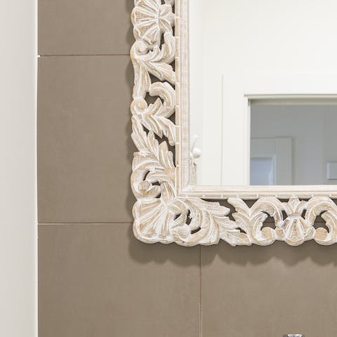 The intricately carved mirror frames