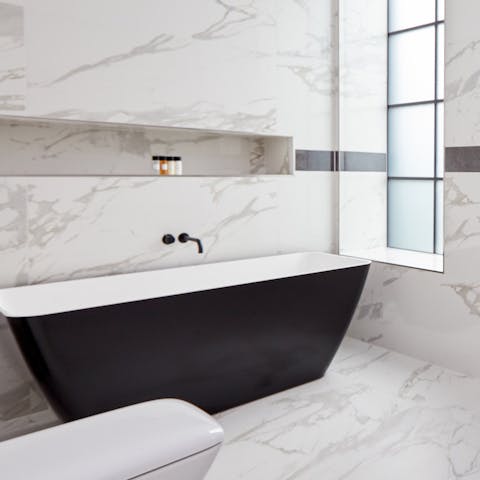A matte black bathtub
