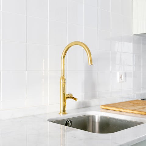 A brass kitchen tap