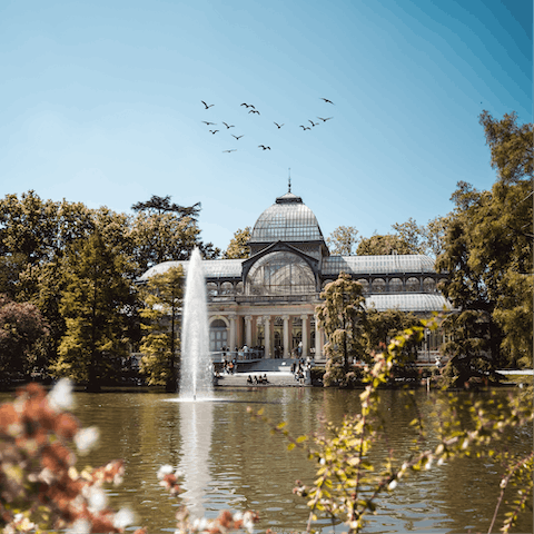 Wander through Parque de el Retiro to reach Palacio de Cristal in twenty-five minutes