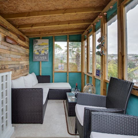 Enjoy a glass of wine in the summerhouse offering sea to Godrevy and beyond