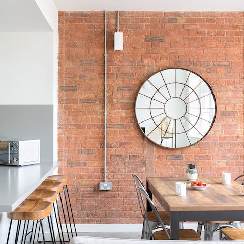 Take in the home's stylish industrial vibe and exposed brick wall
