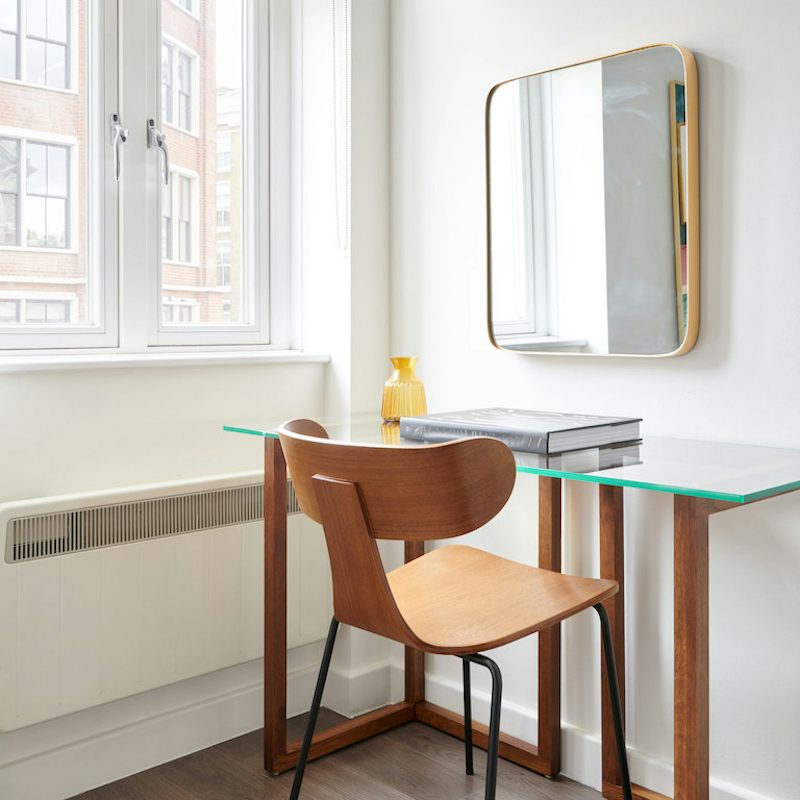 A solid oak scandi desk and chair