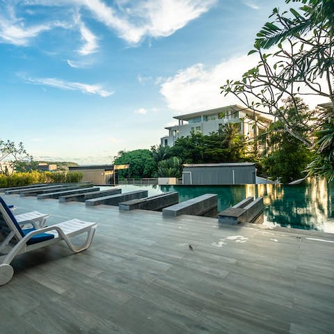 Dive into the emerald green infinity pool to cool off from the tropical heat