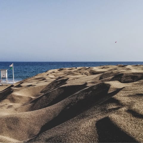 Visit the gorgeous Maspalomas Beach, just a twelve-minute drive away