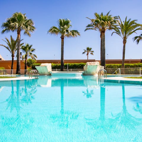 Splash around in the communal swimming pool with the family 