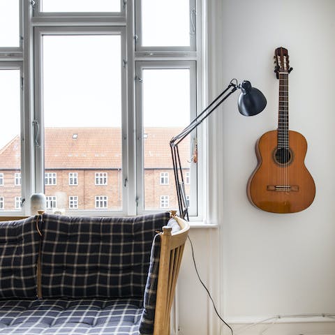 The guitar hung on the wall