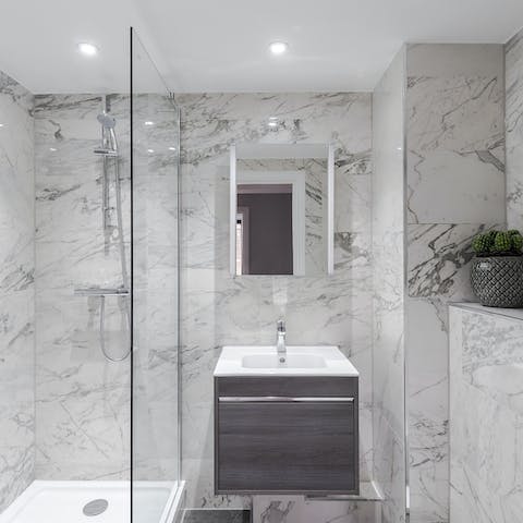 Shower in style in the all-marble bathroom