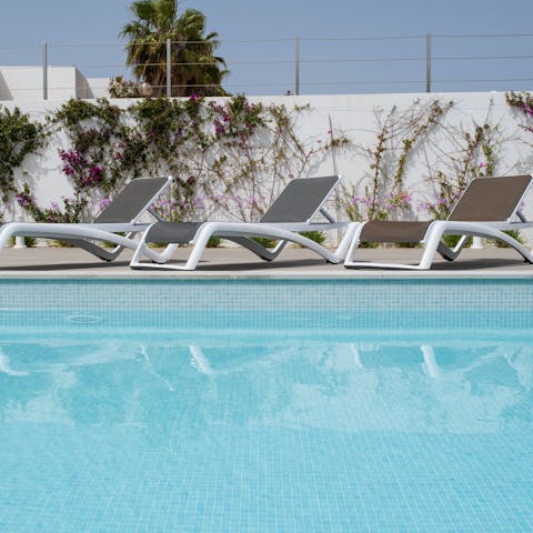 Lie back and soak up the sun by the communal pools