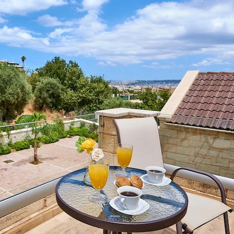 Pad out to the main bedroom's balcony and enjoy your morning coffee in the sunshine