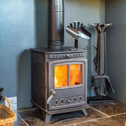 Throw some kindling on the log burner and get toasty around its warmth