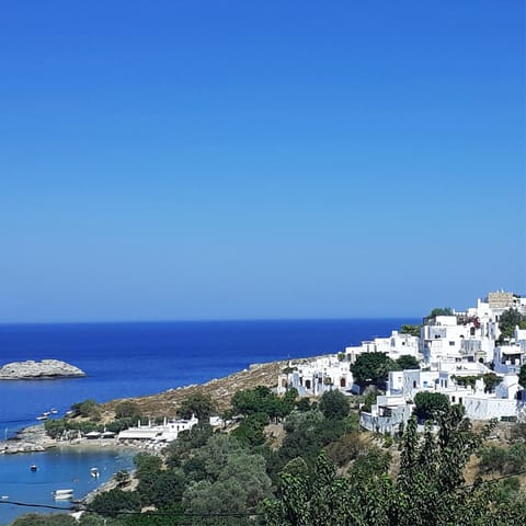 Take a stroll down to Lindos' glistening bay, just five-minutes from your door