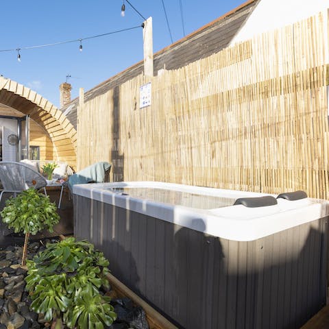 Relax and unwind in your private garden's hot tub