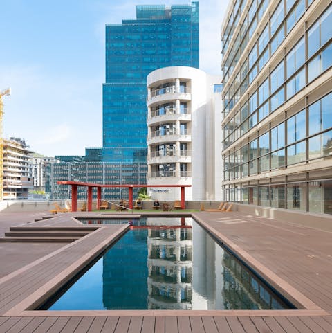 Relax by the pool or go for a swim on the shared terrace, surrounded by stunning city views