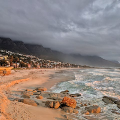 Stroll down the sandy coast of the famous Camps Bay Beach, just a short drive from your doorstep