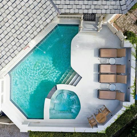 Lounge around the private pool and jacuzzi with a glass of homemade lemonade