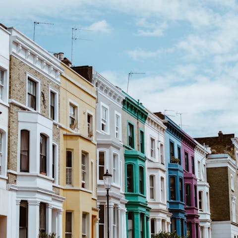 Stroll past the candy-coloured buildings of Notting Hill