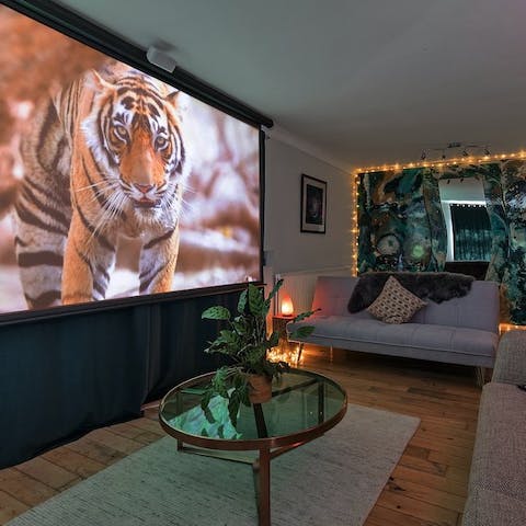 Be absorbed in the latest Hollywood blockbuster on the vast projector screen