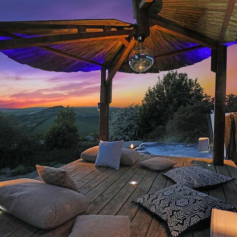 Soak in spectacular sunsets from the bubbling hot tub