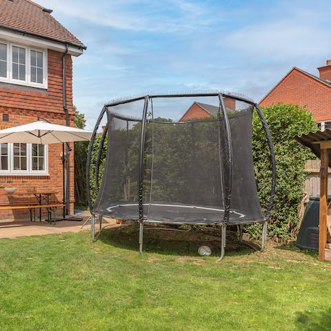 Have a bounce on the trampoline with the kids in the secure back garden