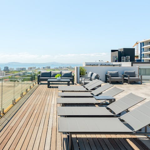 Laze on loungers in the sun or simply admire the pristine panoramic views from the shared rooftop terrace