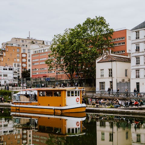 Stroll along the banks of Canal Saint-Martin, less than five minutes' walk from your front door