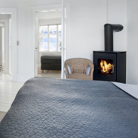 Light up the wood-burning stove in the main bedroom for a cosy night in