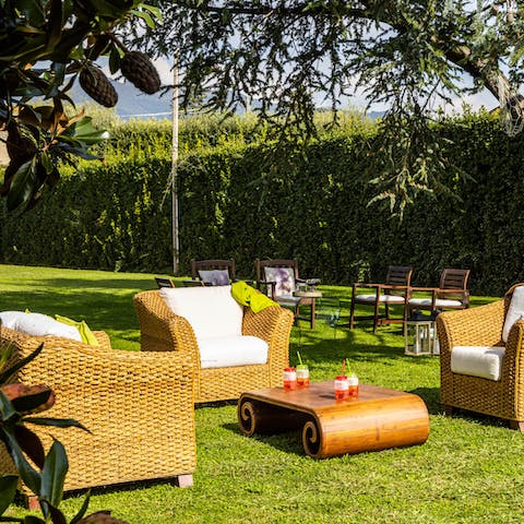 Sit outside in the sunshine in the wicker armchairs