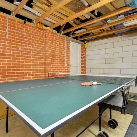 Get competitive over a game of ping pong in the games room 