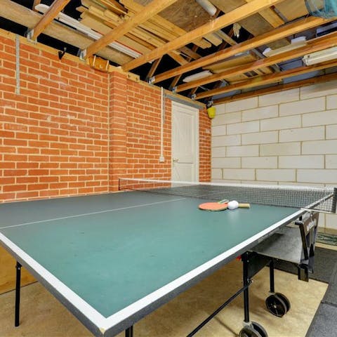 Get competitive over a game of ping pong in the games room