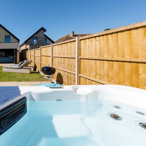 Soak in the hot tub out under the stars in your peaceful and private garden