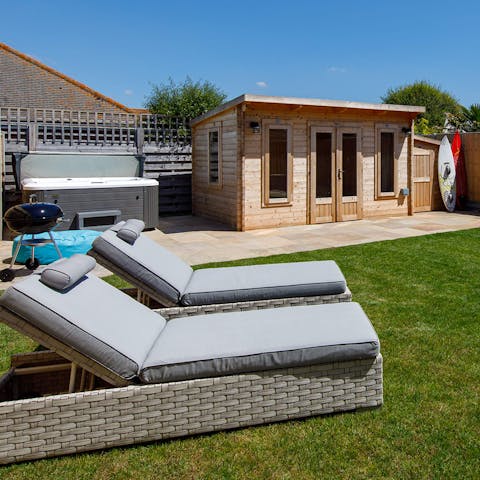 Lounge on the comfy rattan sun loungers when the British sunshine comes out