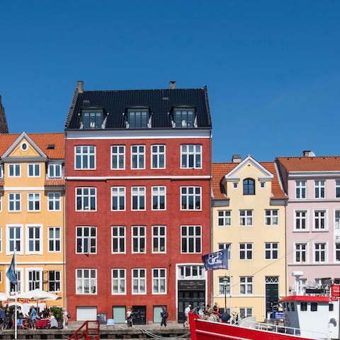 Wander along the waterfront of Nyhavn - only nine-minutes away on foot
