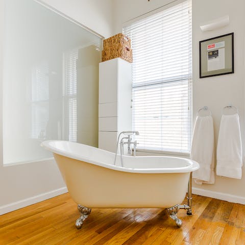 Enjoy an evening soak in the master bathroom's freestanding tub