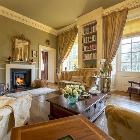 Curl up with a book in the sitting room and read by the fireplace