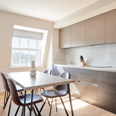 Dine in style in the minimalist kitchen, flooded with natural light